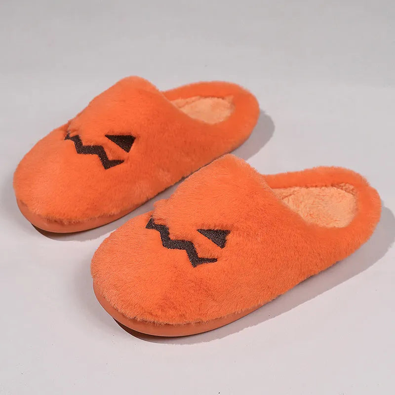 Orange Halloween pumpkin design plush slippers with coral velvet upper and non-slip sole.