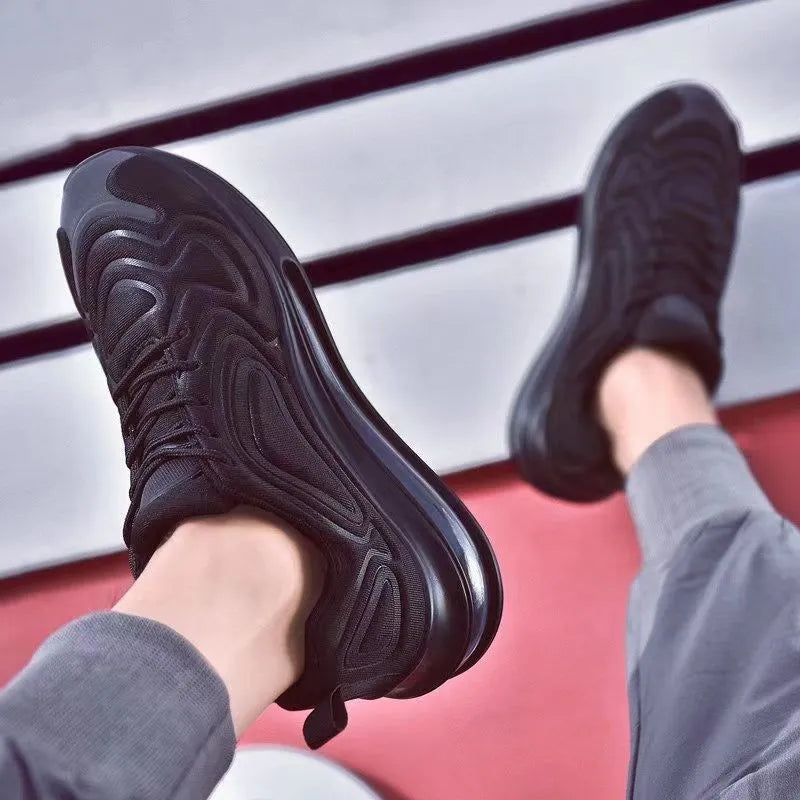 Men's black casual sneakers with artificial PU upper, thick plastic sole, and front lace-up design for outdoor sports.