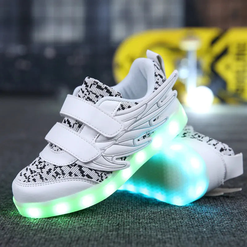Children's plum red and white LED light up sneakers showing USB charging port and hidden mode switch.