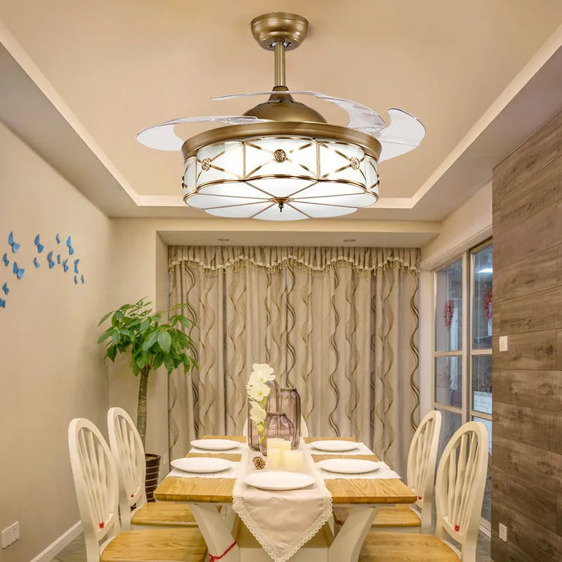 Gold 42-inch ceiling fan light with invisible blades and remote control on a white ceiling.