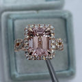 Geometric-shaped alloy ring with a rose gold electroplated finish on a neutral background.