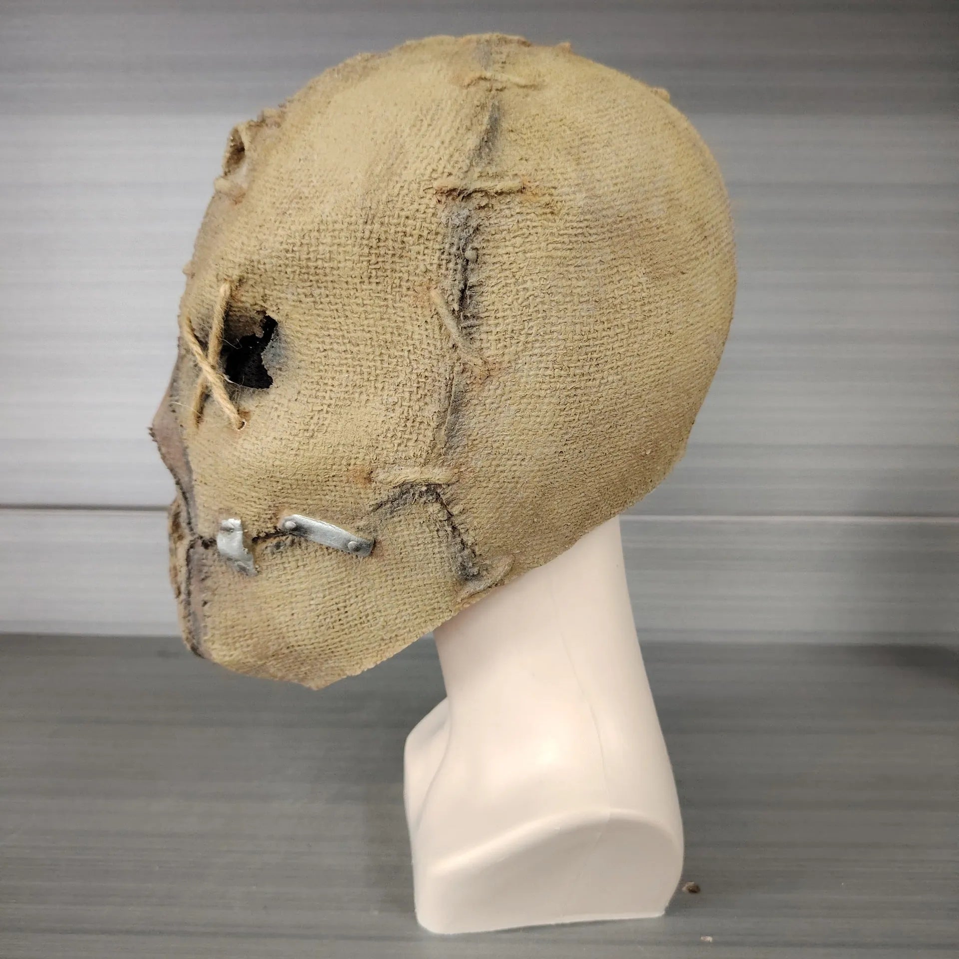 Latex horror head cover with detailed scar skull modelling measuring 31cm tall