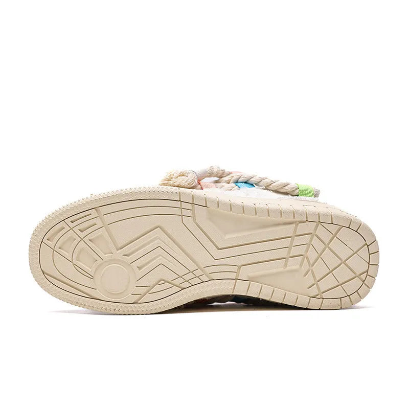 Creamy white low-top retro skate shoes with candy-colour sewing thread details on microfiber upper.
