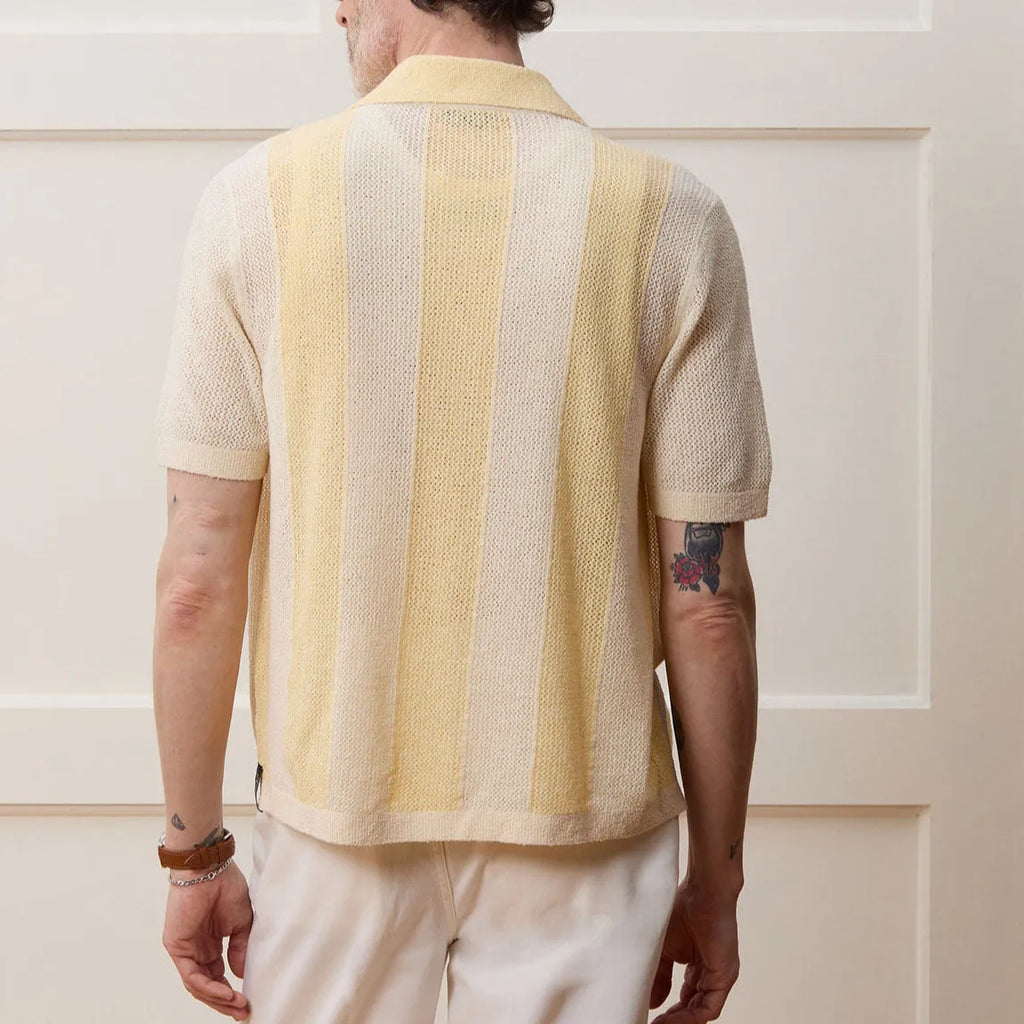 Yellow casual polo shirt with hollow-out pattern and asymmetric design detail, short sleeves
