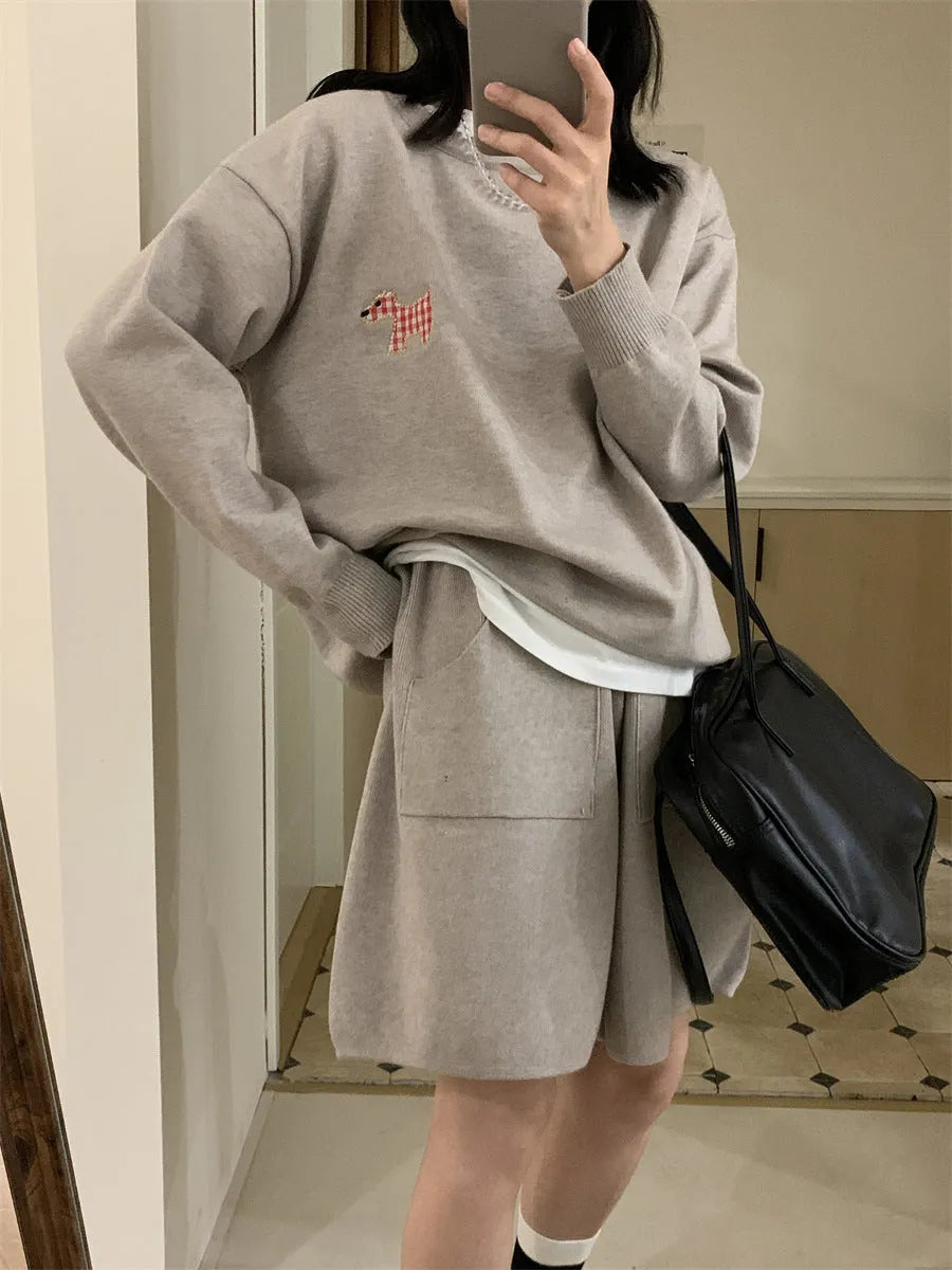 Women's milk blue casual knitted sweater and shorts suit with animal pattern embroidery.