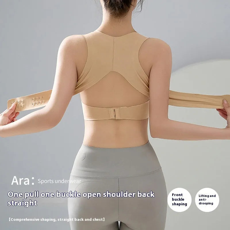 Women's front buckle sports bra in black, white, or nude for yoga and exercise.