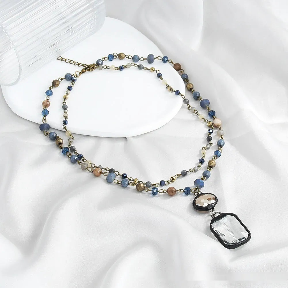 Two-layer tribal necklace with stone and glass pendants on alloy chain, adjustable length