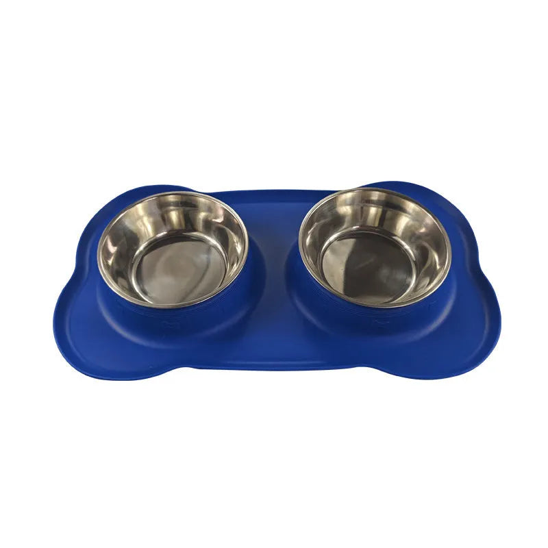 Large silicone dog bowl with a stainless steel inner insert, shown in blue on a floor.