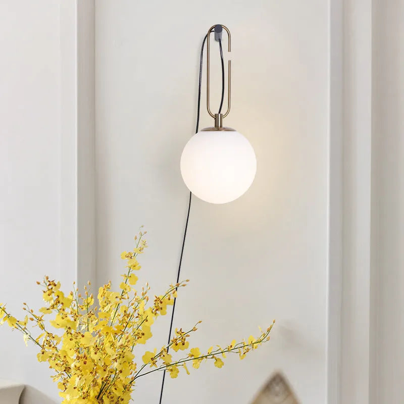 Nordic modern glass wall lamp with three light colour options on white wall