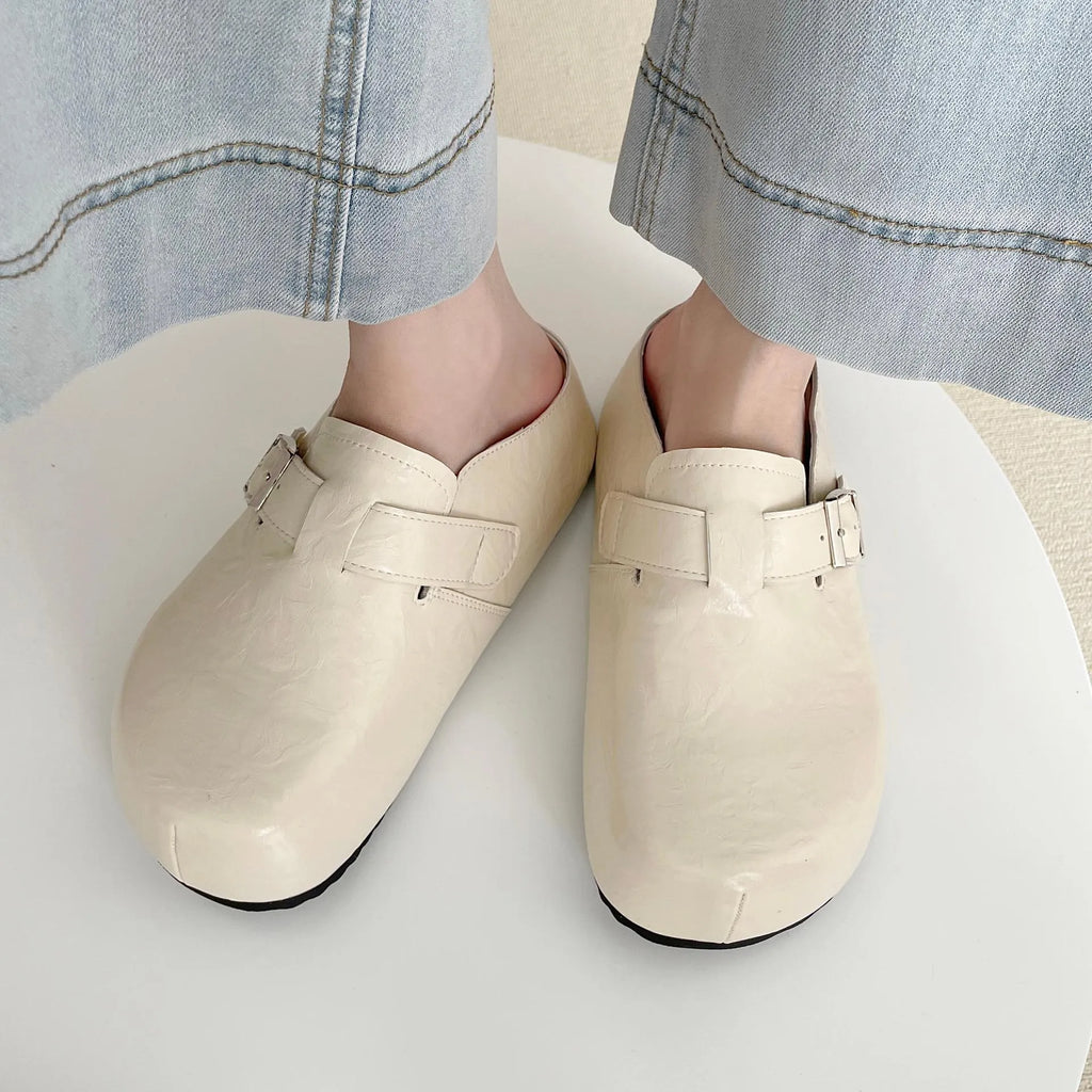 Flat casual sneakers with a buckle fastening and round toe in multiple colour options.