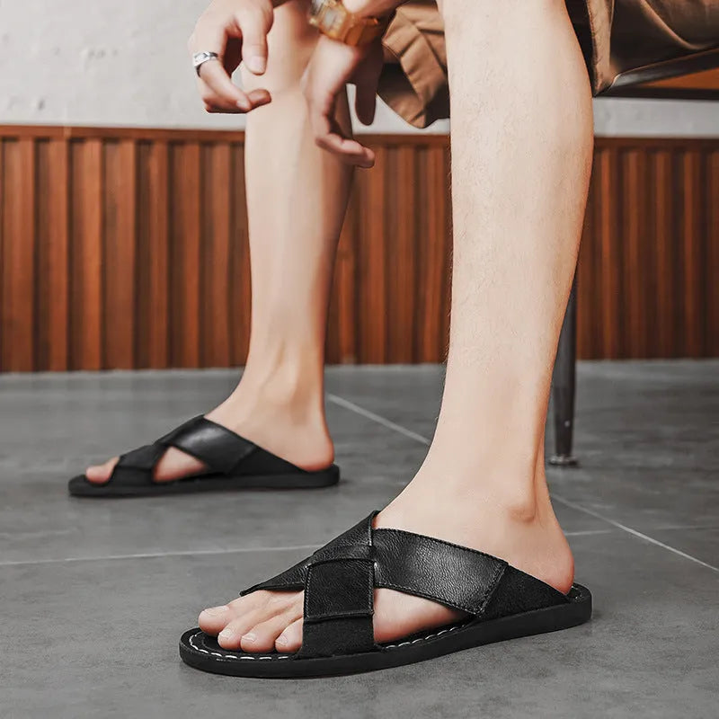 Men's black casual slip-on sandals made from genuine pigskin leather with a frosted finish and rubber sole.
