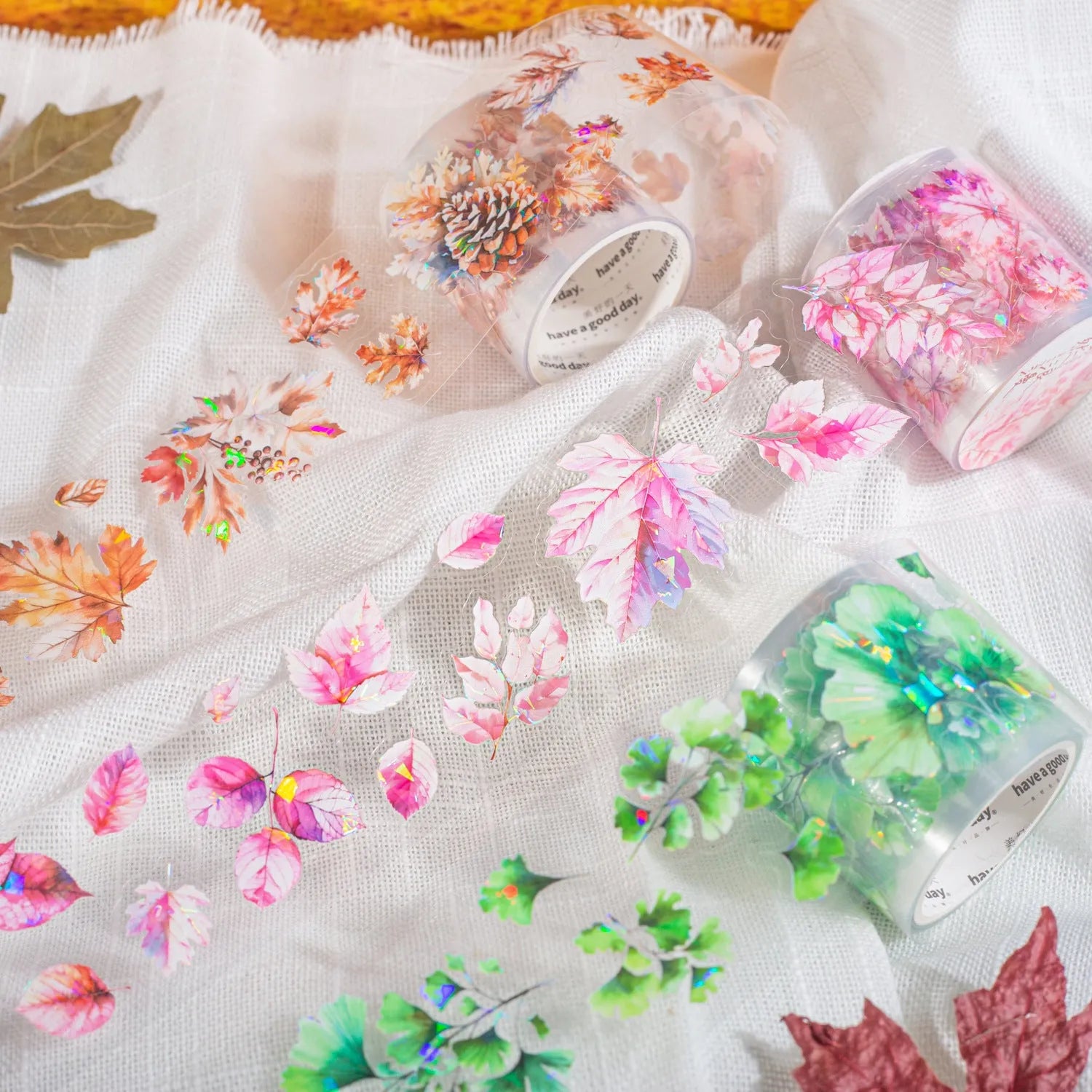 Roll of autumn leaf decorative stickers showing six colour variations including ginkgo and maple patterns