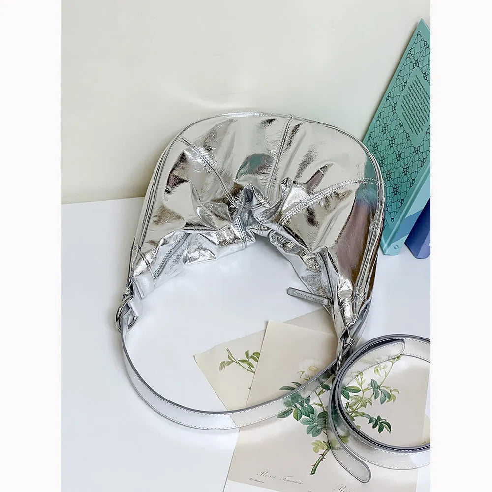 Women's soft cowhide leather dumpling-shaped shoulder bag in silver colour with double straps.