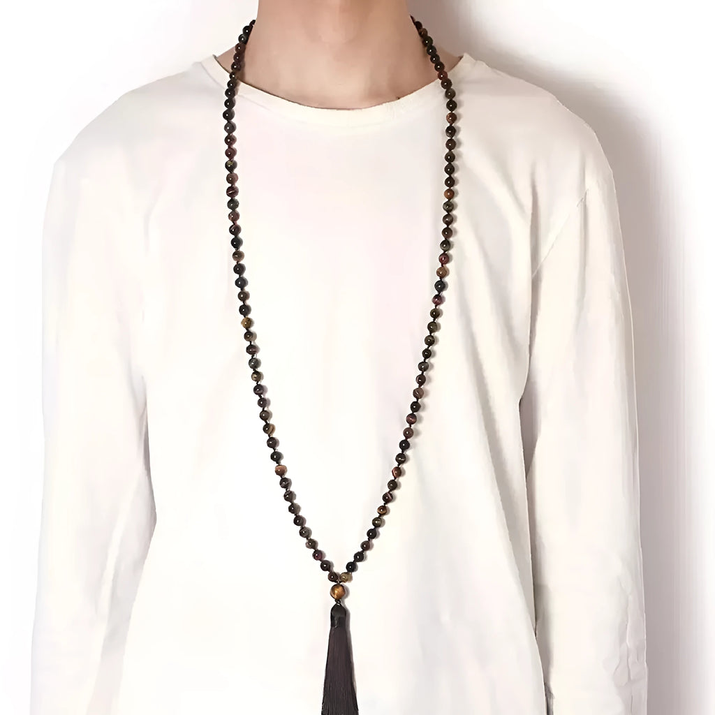 Long multi-stone agate and amethyst tassel necklace with blue pattern, geometric beads.