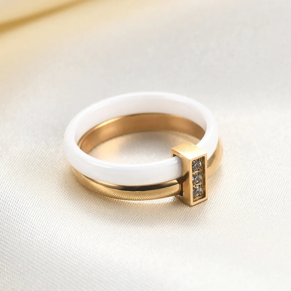 Ceramic women's ring with 6mm band width and inlaid zirconium accents in geometric round design