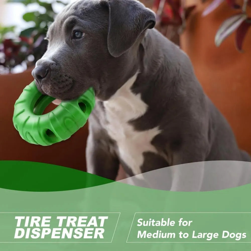 Blue rubber tyre-shaped dog chew toy with oval openings for treat dispensing