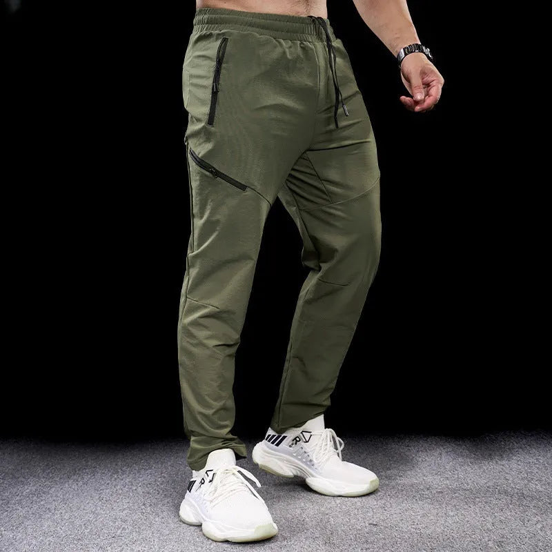 Men's black waterproof quick-drying nylon workout pants for sports and exercise.