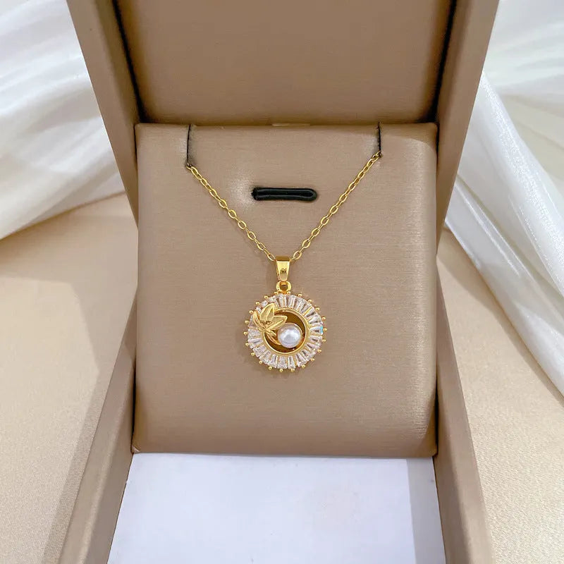 Titanium steel and gold plated geometric jewellery set showing necklace with copper pendant and matching stud earrings