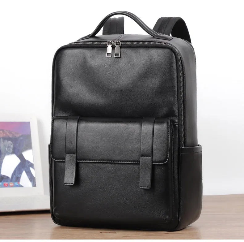 Men's black genuine leather computer backpack with weaving detail and large 36-55L capacity.