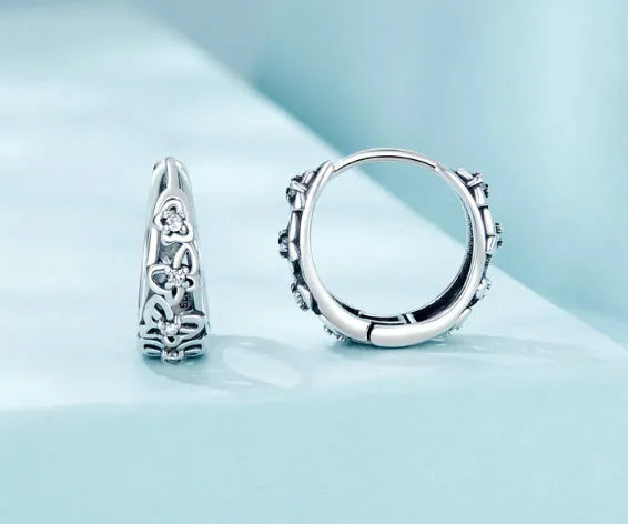 Sterling silver hollow butterfly earrings with zircon accents measuring 14mm by 5mm