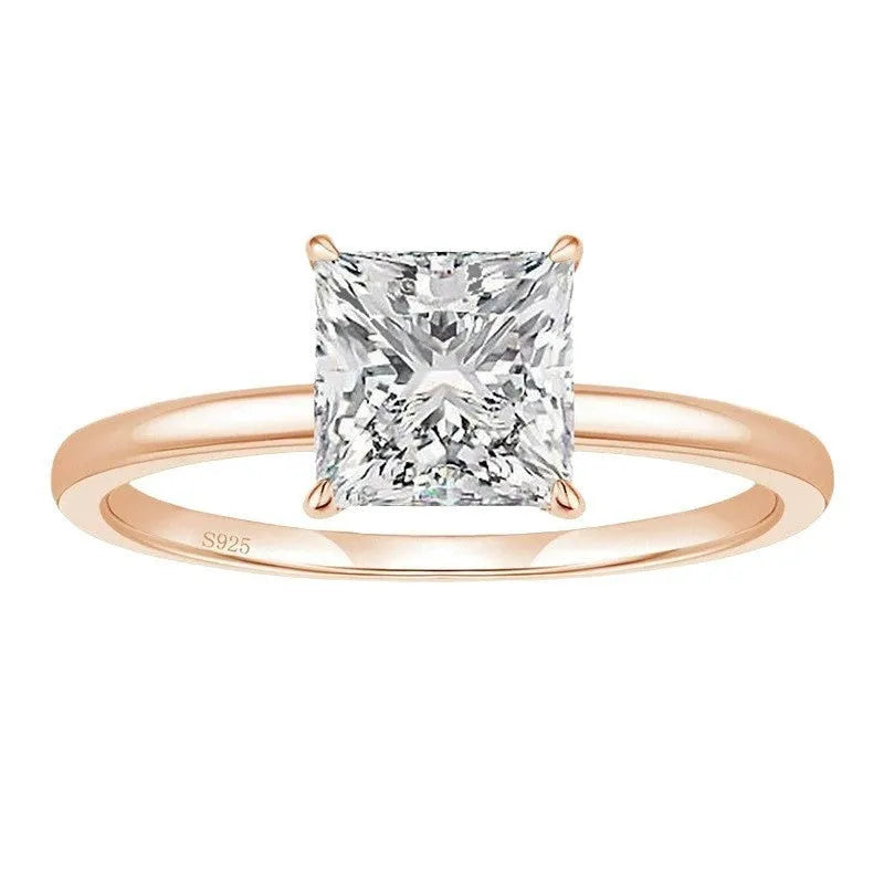 A simple geometric sterling silver ring with a round polished zirconium stone, shown in silver colour.