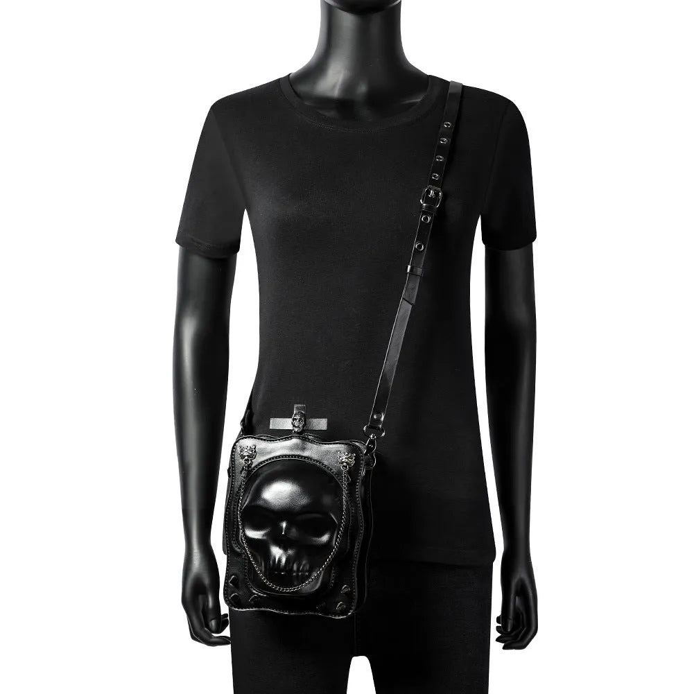 Black Halloween skull mini square messenger crossbody bag with stitching, rivets, chains, and embossing details