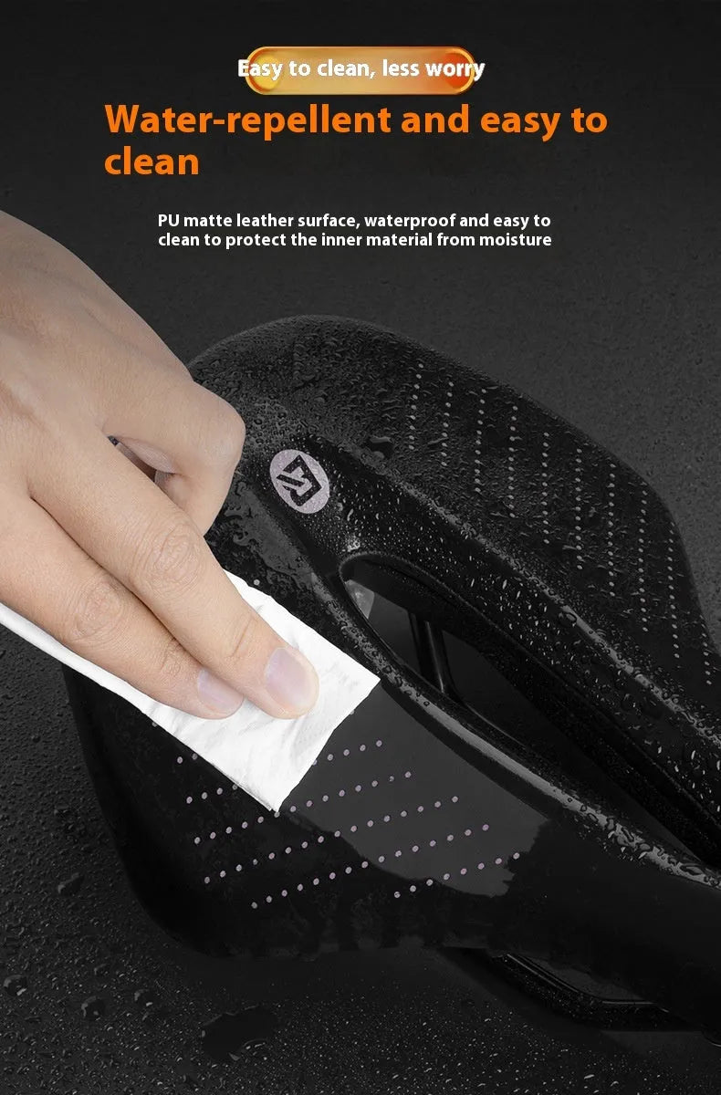 Black and pink bicycle seat cushion for mountain bikes and sports road bikes with PU foam construction