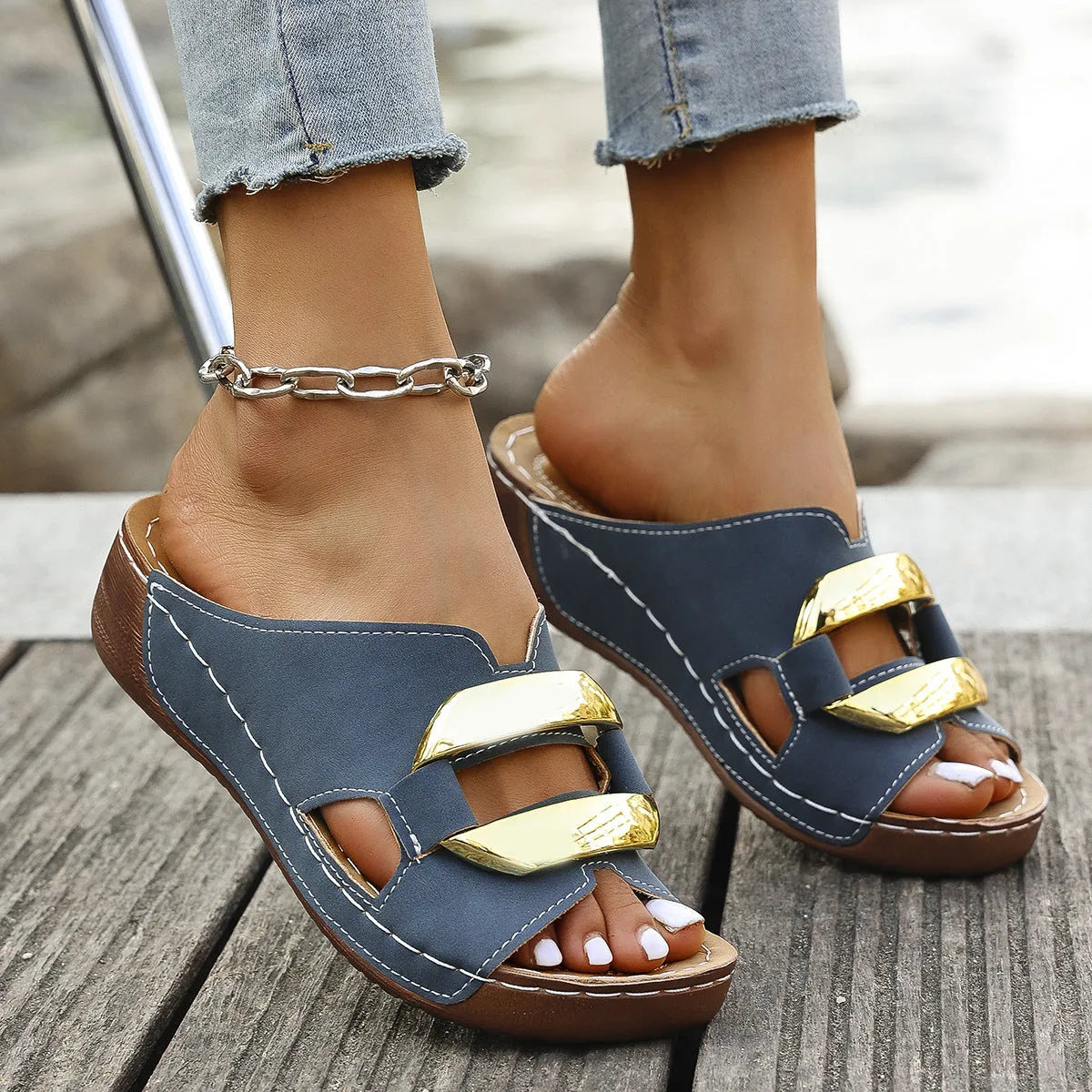 Roman style platform flip-flop sandals in white, black, khaki, and sea blue colours on a solid background.