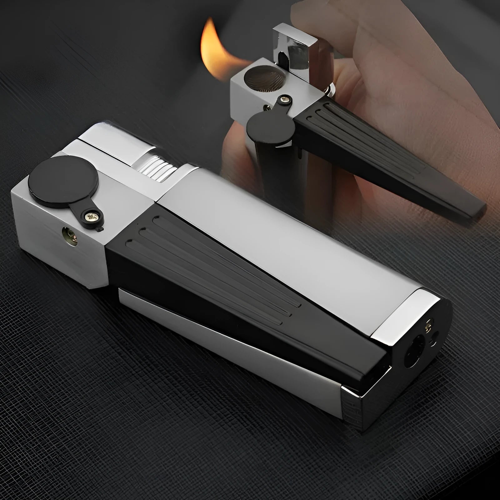 Silver foldable metal pipe lighter shown open, revealing lighter mechanism and small storage compartment.