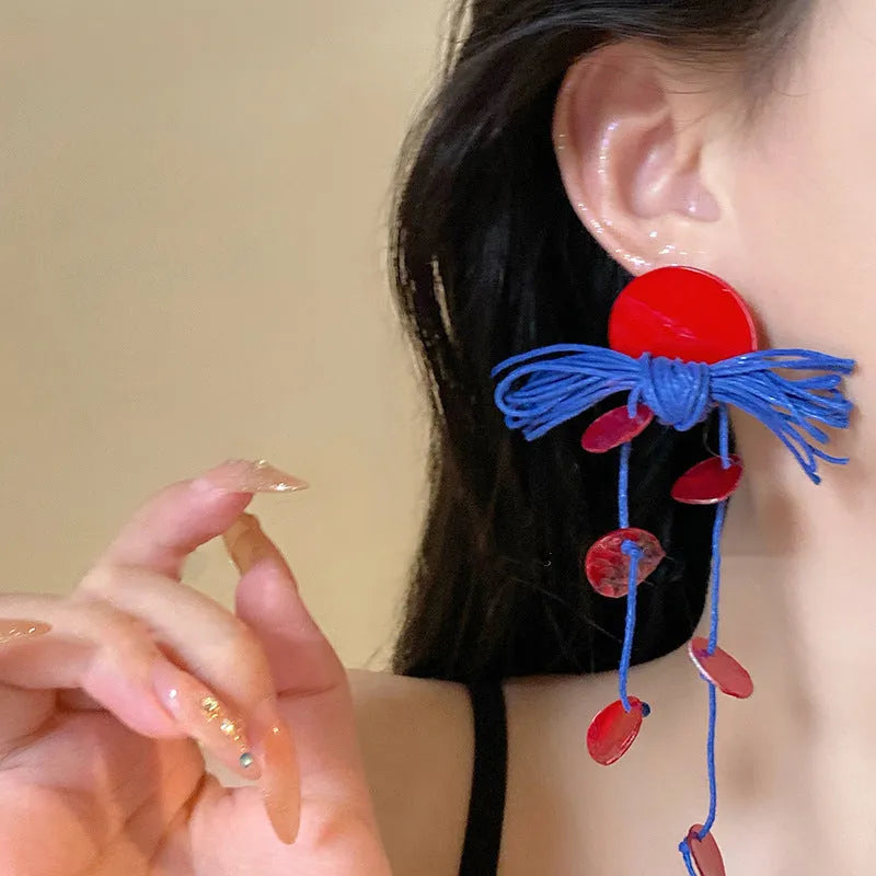 Geometric cloth women's earrings in 30 Silver Needle colour with blue resin flower detailing