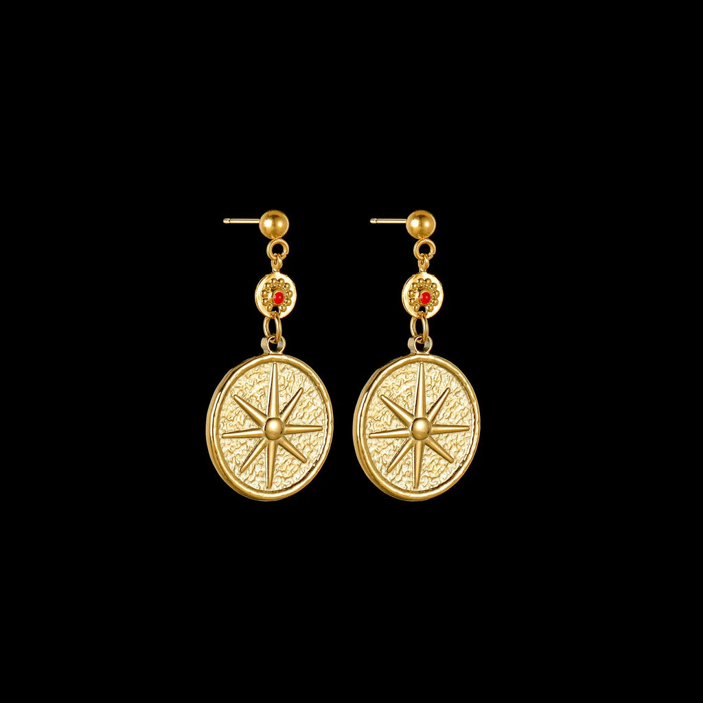 Three pairs of geometric stainless steel drop earrings showing Eight Awn Star, Eye, and Shell Sun designs