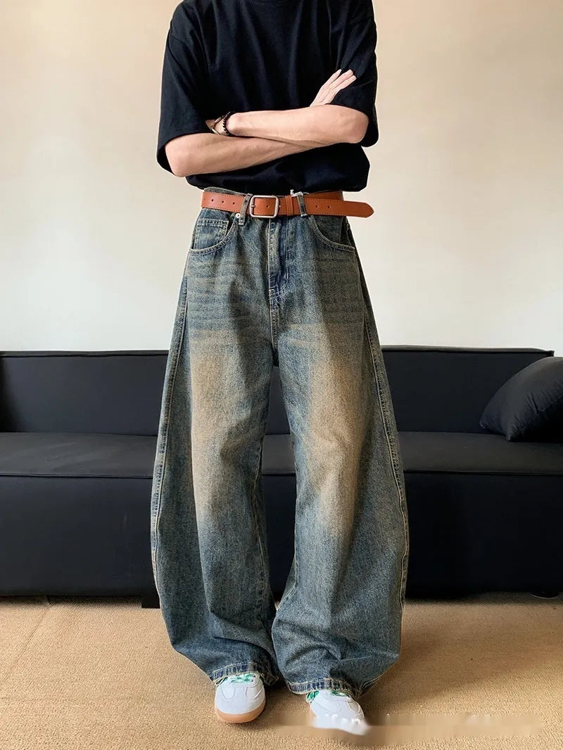 Men's retro blue distressed denim pants with wide leg cut and micro elasticity fabric