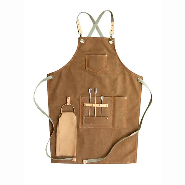 Cross-back canvas apron in camel colour with adjustable straps for café and baking work