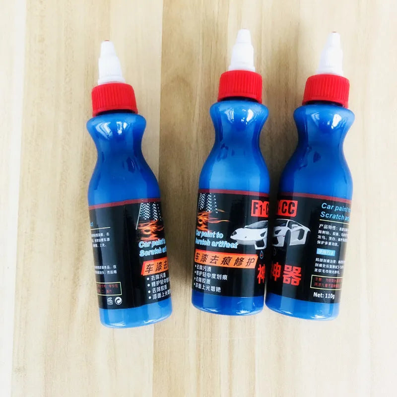 Blue car scratch repair cream bottle with applicator tool for automotive paint damage