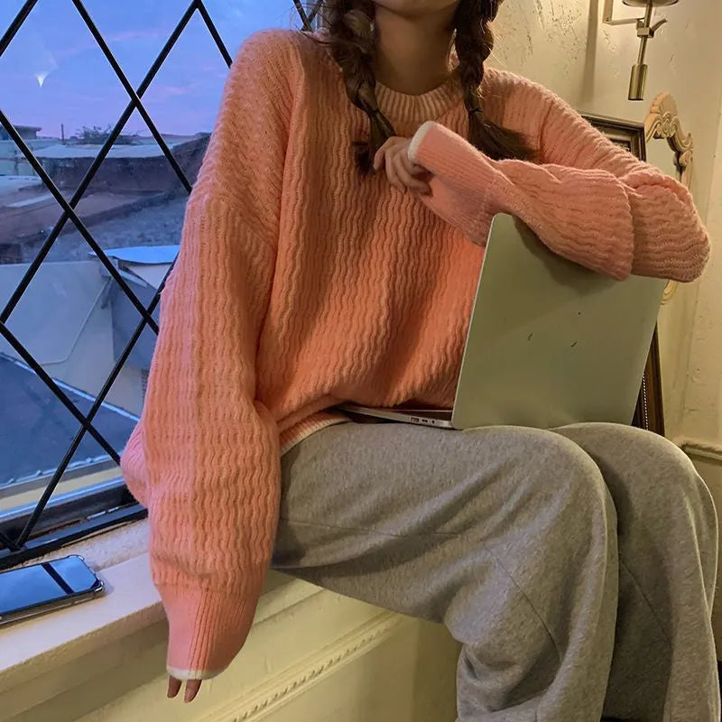 Women's loose solid colour polyester sweater in lake blue, shown on a hanger.