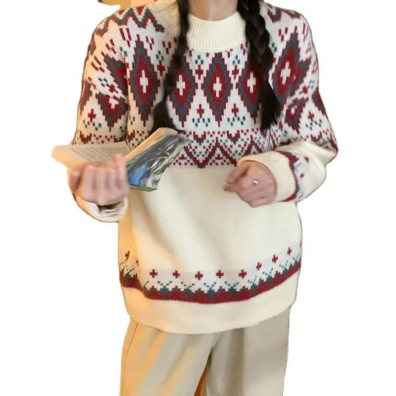 Red and white striped loose fit long sleeve knitted pullover top on a hanger.