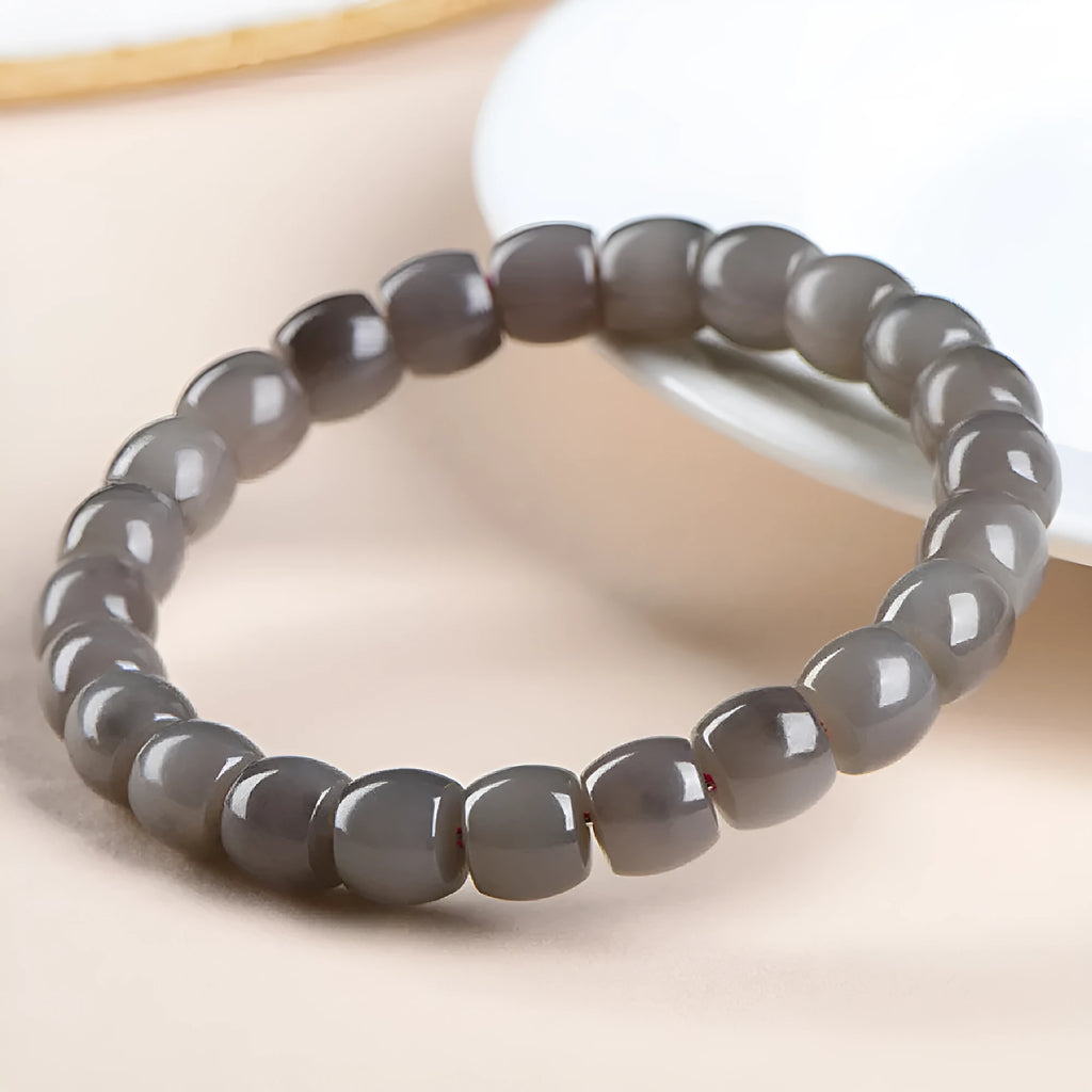 Straight cut smokey violet Hetian jade bracelet with approximately 24 beads measuring 8x9mm.