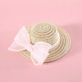 Pet cat wearing woven straw hat with pearl bow decoration in monochrome princess style
