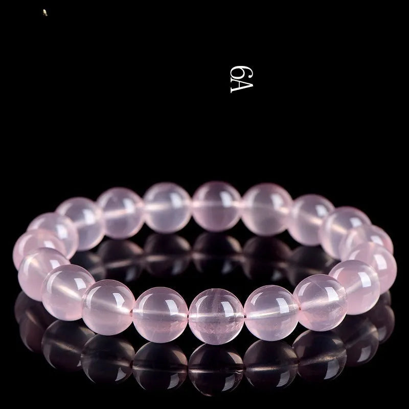 Women's natural starlight crystal bracelet with round pink beads in selectable sizes from 6mm to 22mm.