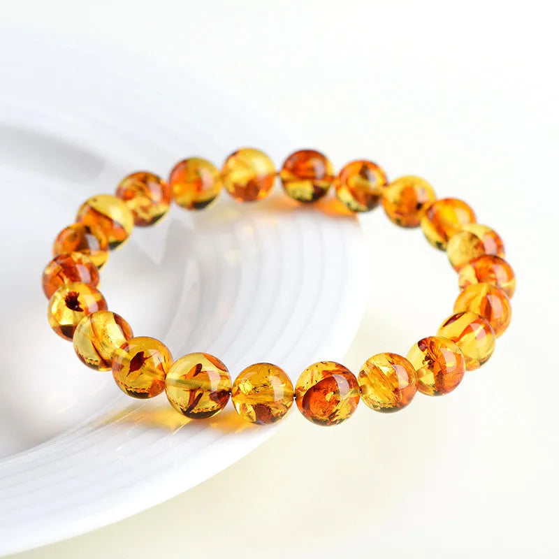 Natural yellow piebald amber water purification bracelet with geometric beads