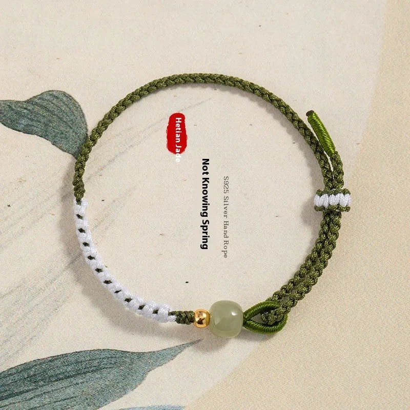 Chinese national bracelet with colourful cord carrying strap and electroplated sterling silver fittings