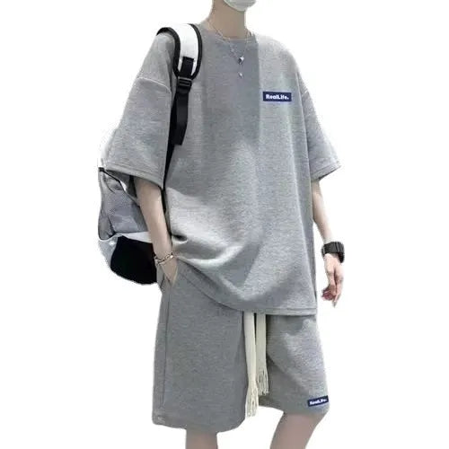 Waffle texture leisure sports suit set consisting of a short sleeve top and shorts, shown in blue.