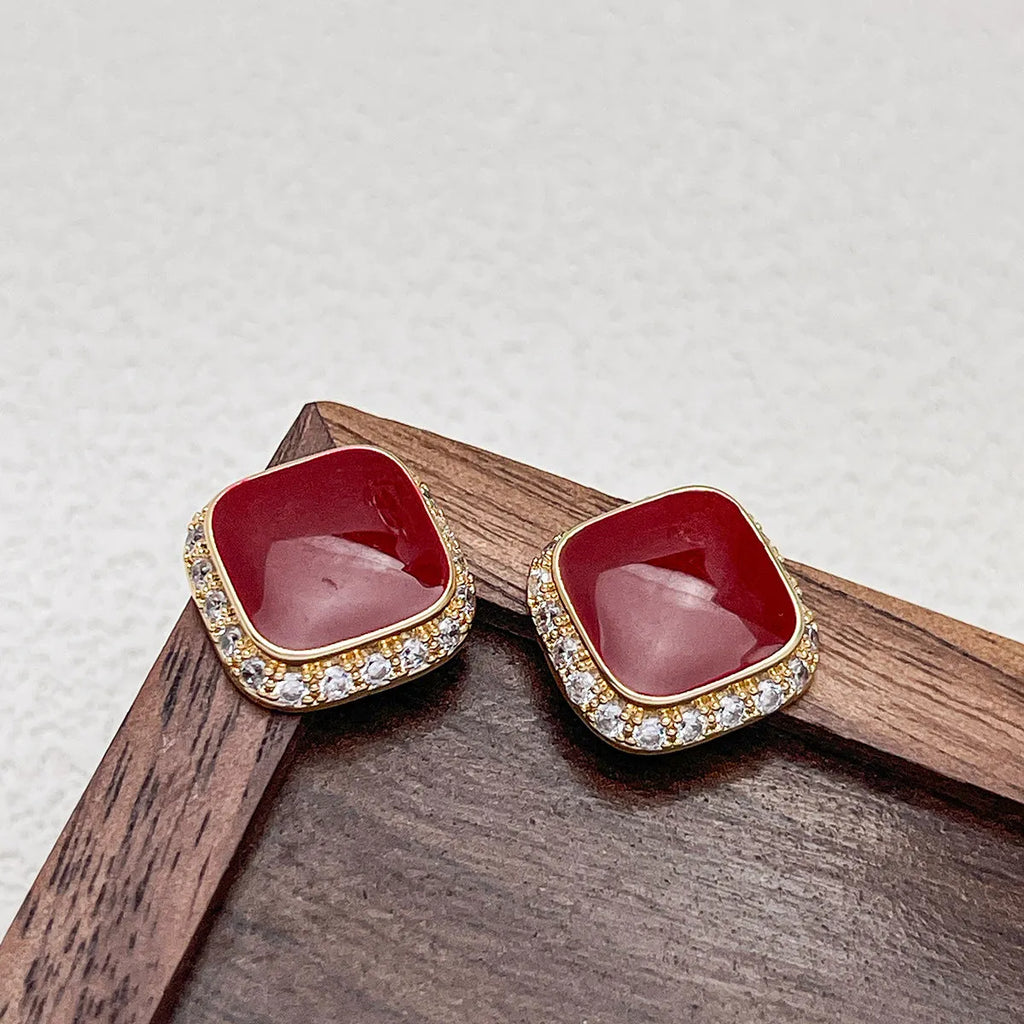 Red geometric alloy drop earrings with square detail for women.