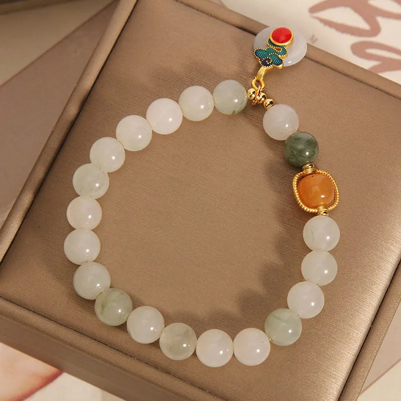 Women's ice jade bracelet with pearl accents and a jade buckle on a retro design.