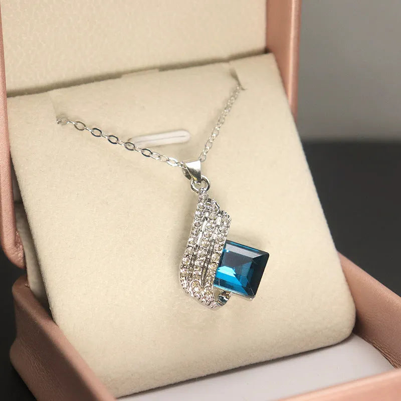 Glass and alloy necklace and earring set with cross chain design and electroplated metallic finish