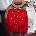Pink cashmere blend cardigan coat with beaded details on a hanger