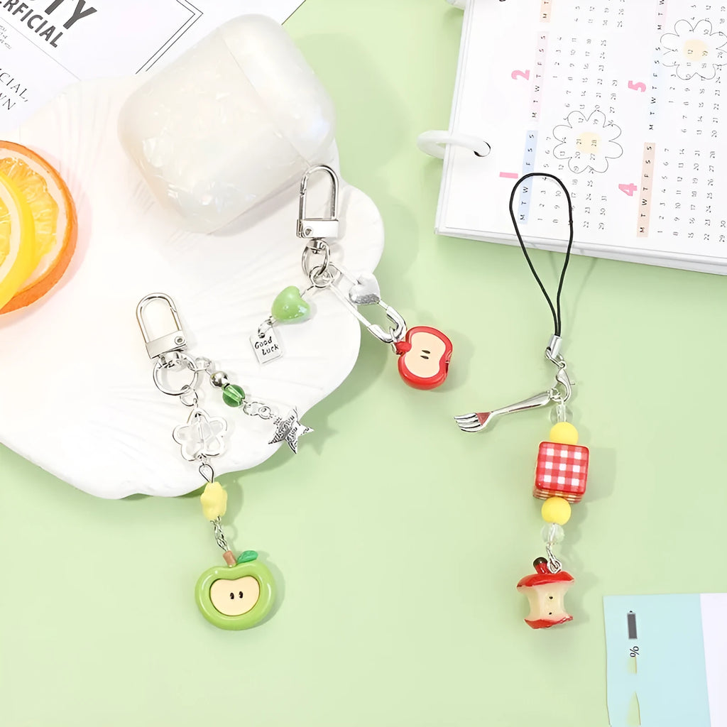Cute fruit design plastic phone charm keychain on a white or silver rope.