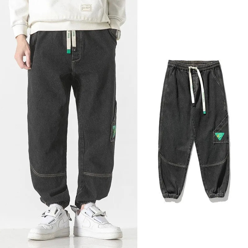 Men's loose-fit tapered cotton trousers in black, blue, or grey colours with mid waist design