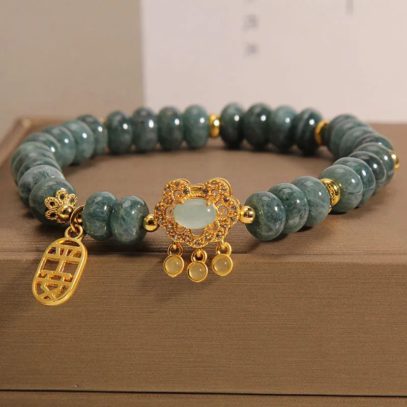 Women's bracelet with natural emerald jade abacus beads and alloy safety lock closure