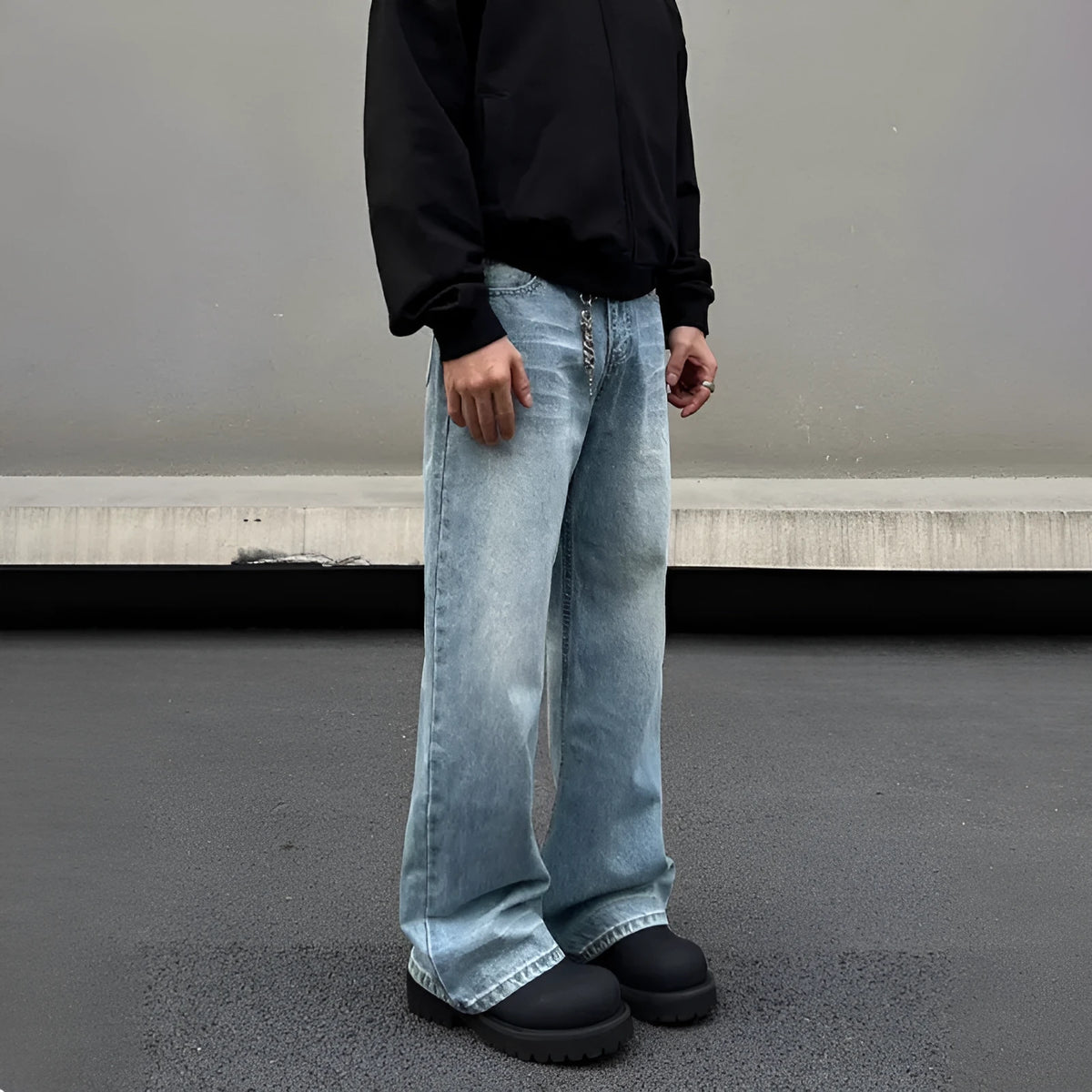 Men's blue straight leg denim jeans with whisker wash detailing and visible stitching on a medium-high waist.